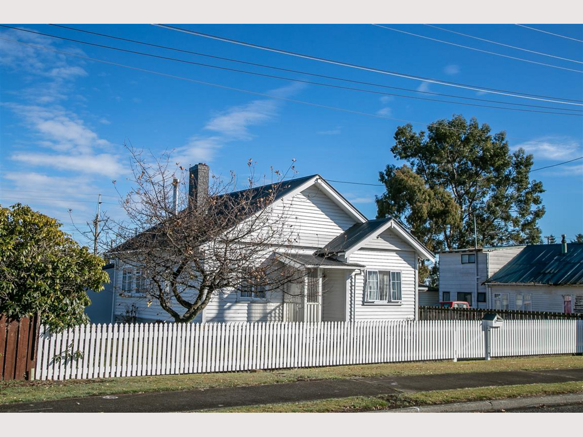 BEHIND THE WHITE PICKET FENCE